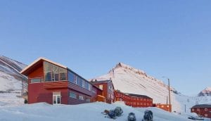 Funken Lodge Svalbard red houses snow