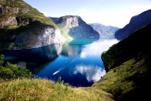 norway in a nutshell blue water green fjords light sky
