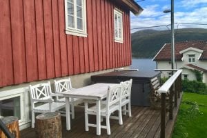 Outside patio of Budeia Lodge during summer in Kvaløya, Arctic Norway