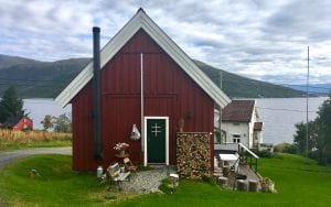 Budeia Lodge view of exterior entrance during summer in Kvaløya, Arctic Norway