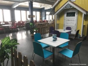 Basecamp Snowman indoor tables cafe