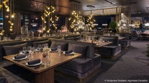 Three set dinner tables in restaurant of Funken Lodge in Svalbard, Arctic Norway