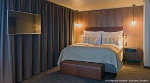 TV and double bed in room at Funken Lodge in Svalbard, Arctic Norway