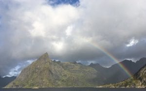Rainbow and clouds over a fjord in Hamnøy, Lofoten