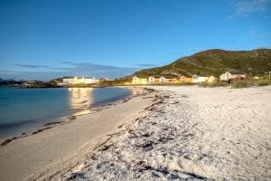 Twilight view of the white beach next to Sommarøy Arctic Hotel in summer near Tromsø, Arctic Norway