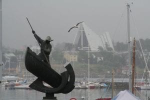 Statue of man with spear on boat in Tromsø, Norway