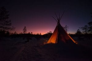 sami storytelling twilight with stars and a camping tent