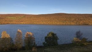 Utsjoki Church Village with Lake and trees in the distance