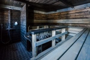 Sauna indoors with coals and a shower