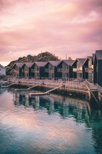 Hamn i Senja Apartments Norway pink sky calm water